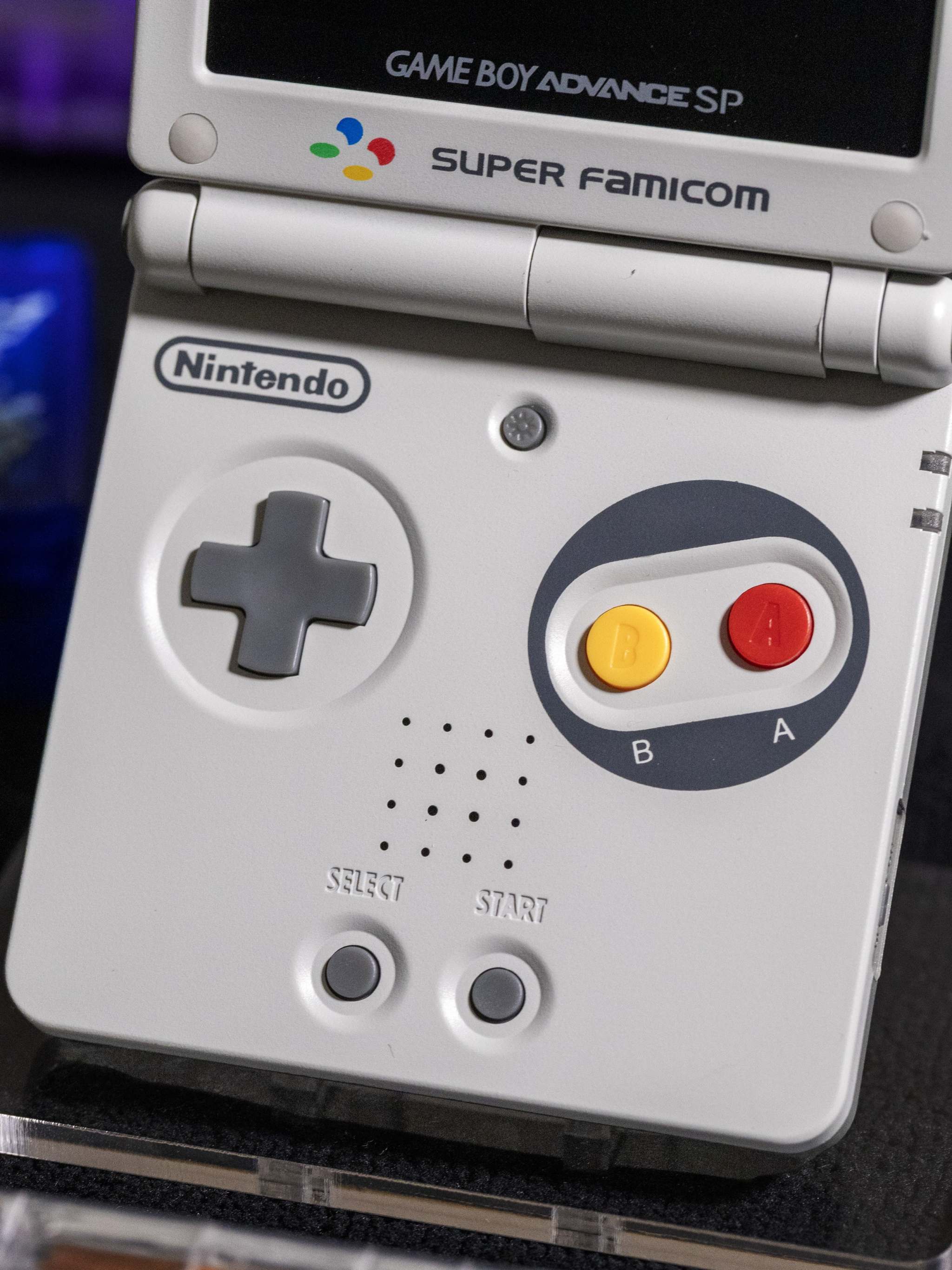 Gameboy Advance SP Super Famicom Edition with grey shell and colored buttons on IPS V5 display