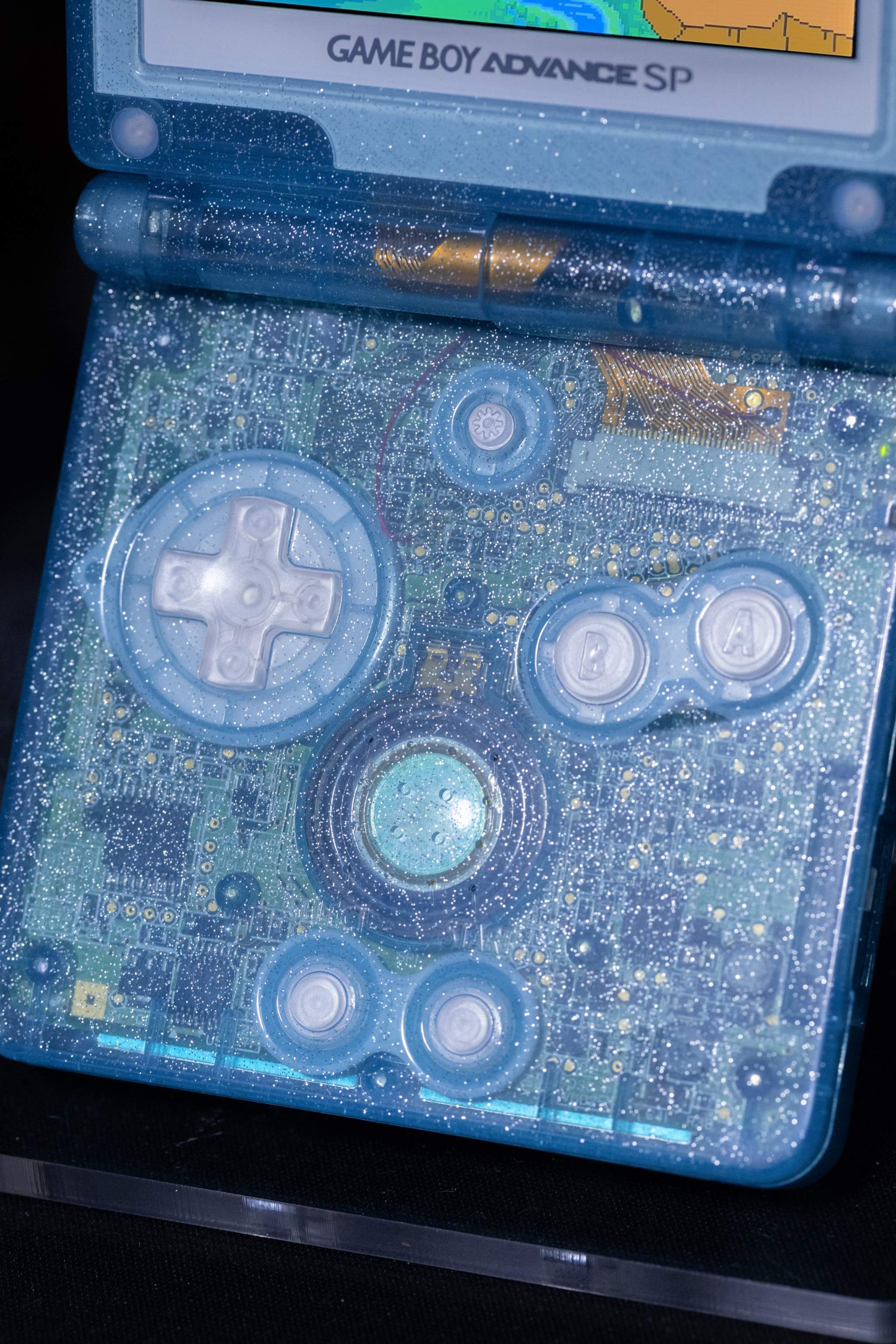 Custom Suicune Pokémon Game Boy Advance SP with transparent blue shell and IPS V5 backlit screen