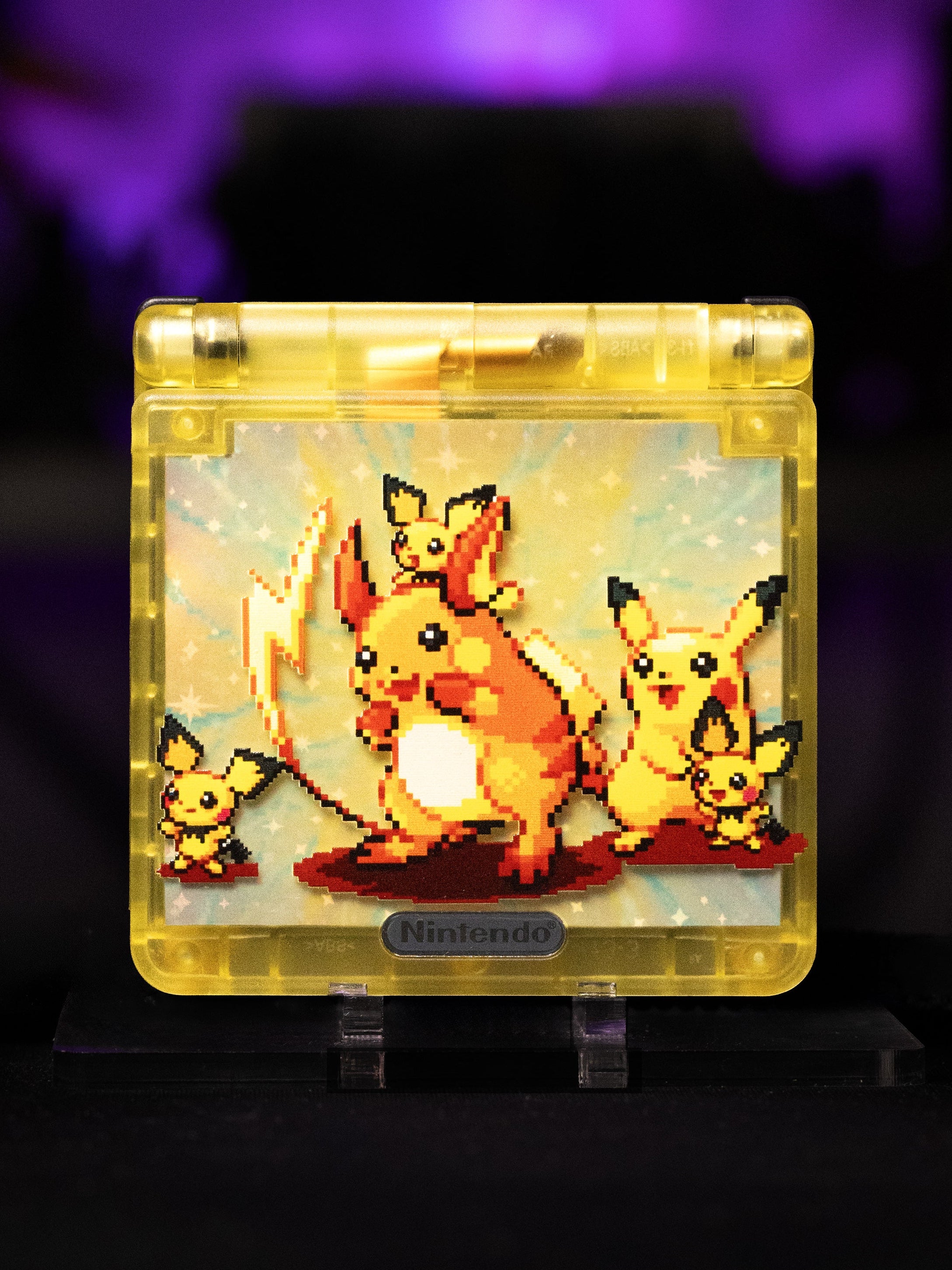 Nintendo-themed decorative item with Pikachu and Eevee on a dark background