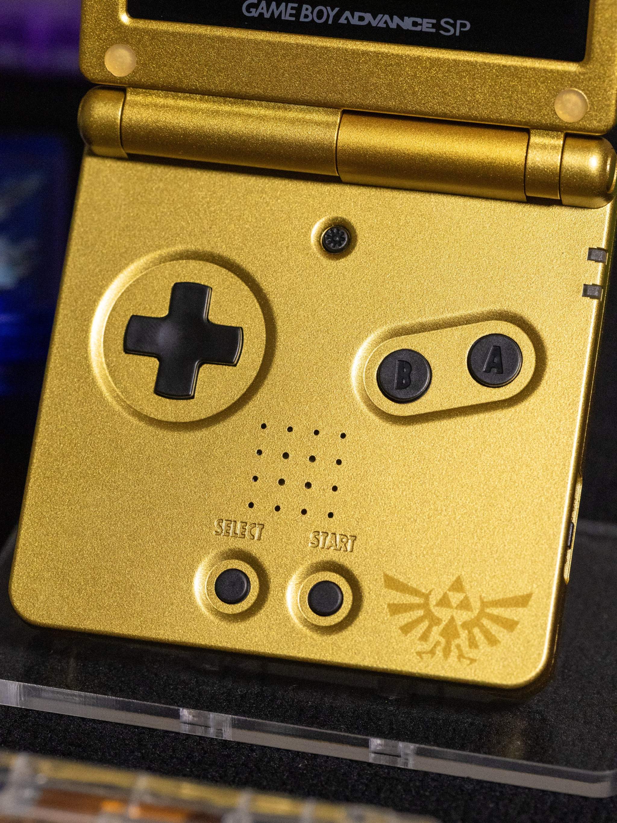 Refurbished Game Boy Advance SP Zelda Triforce Edition with gold shell and IPS V5 screen