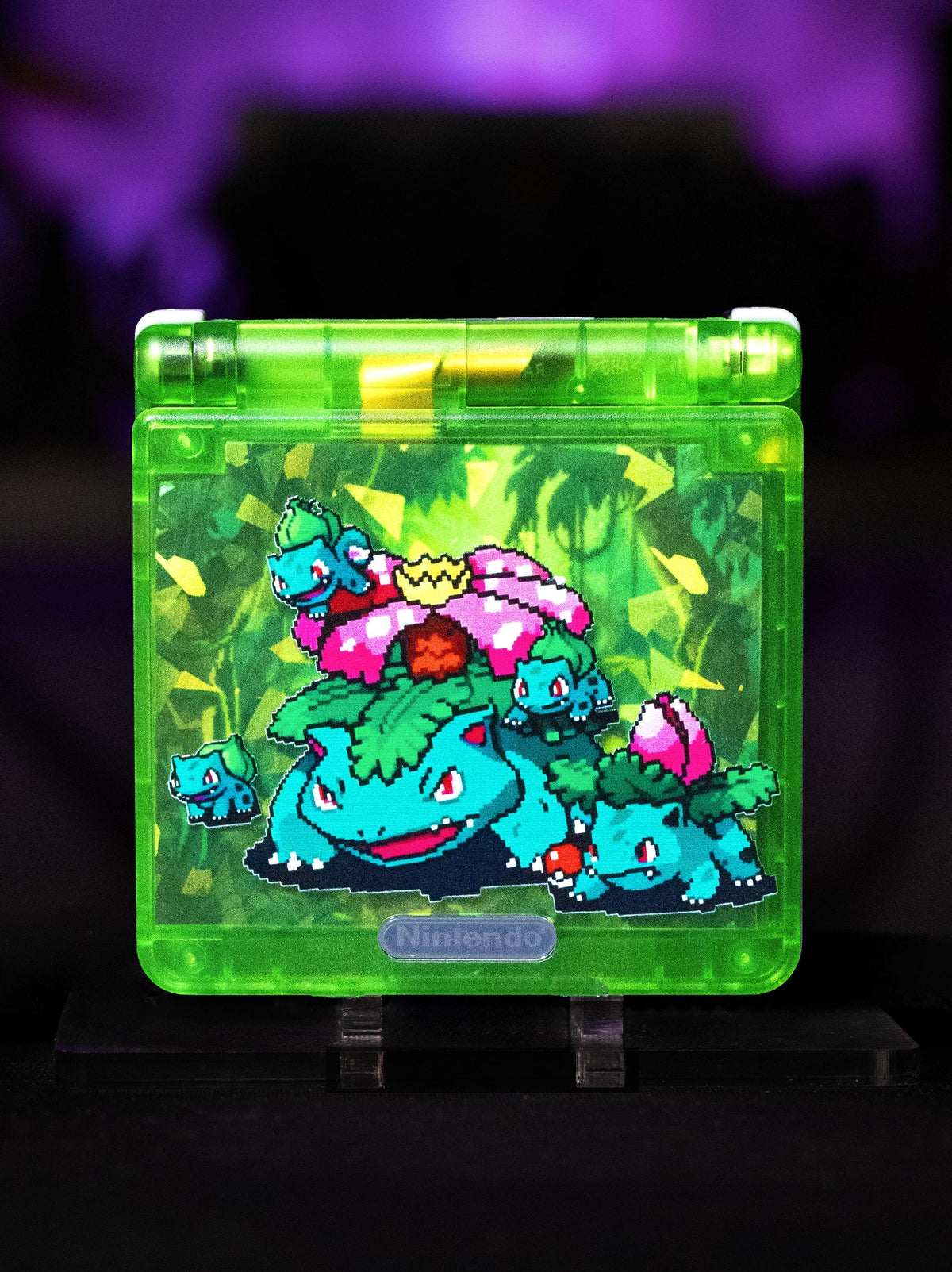 Game Boy Advance SP Venusaur Edition with green shell and Pokémon artwork