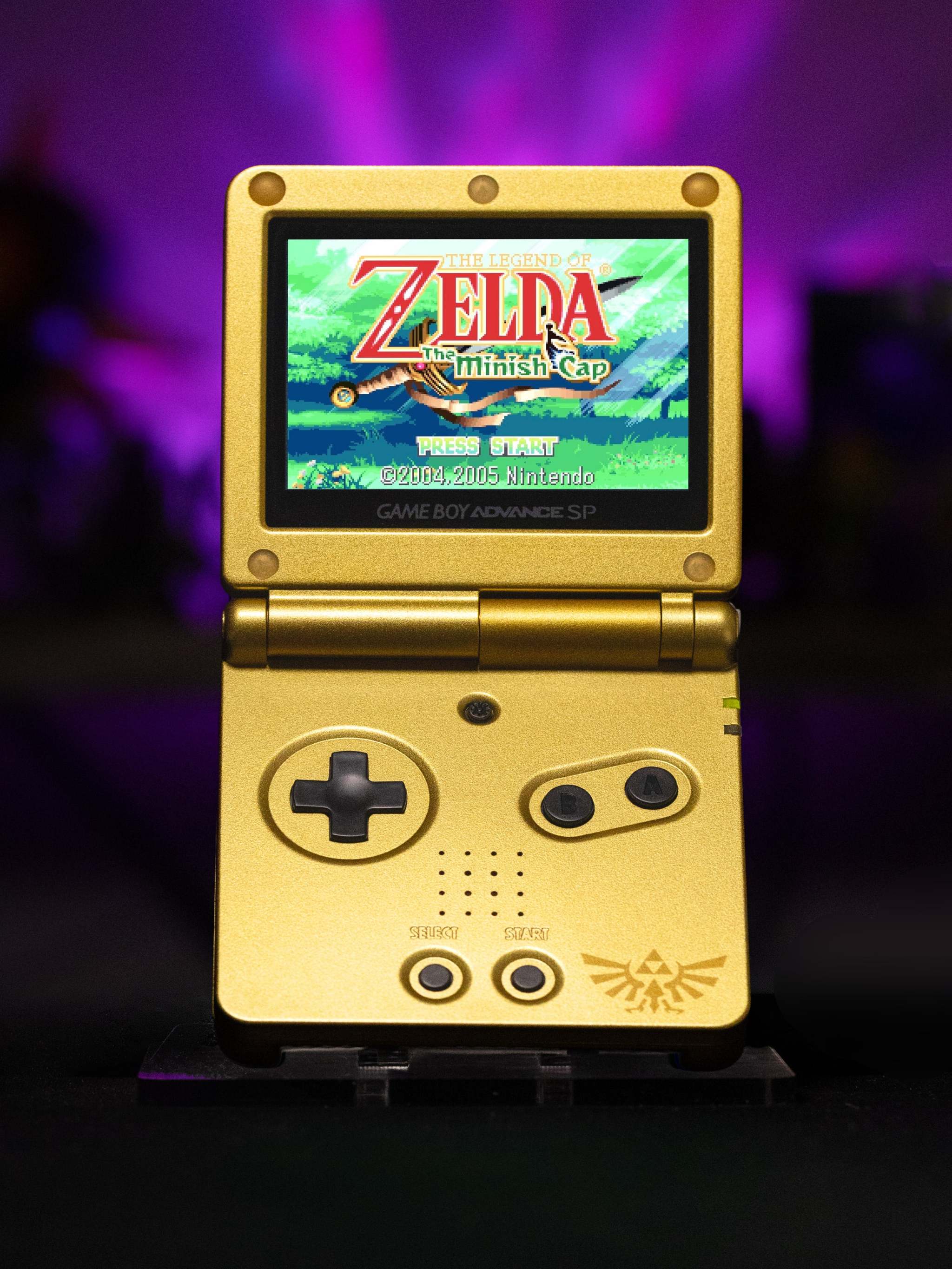 Gold Game Boy Advance SP Zelda Triforce Edition with IPS V5 backlit screen and Nintendo AGS-101 motherboard