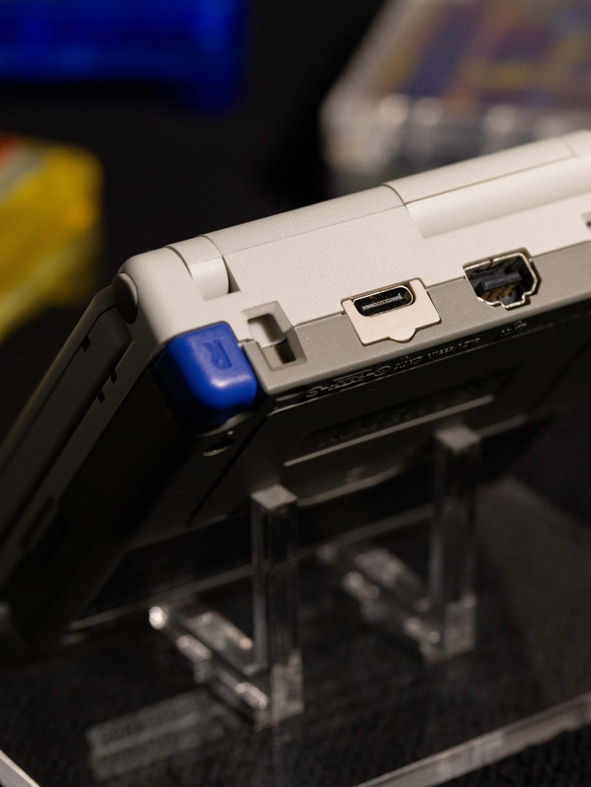 Gameboy Advance SP Super Famicom Edition with grey shell and colored buttons on IPS V5 display